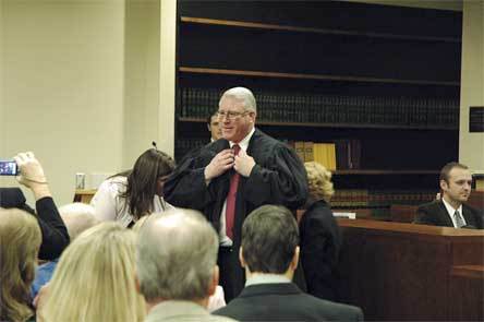 Joe Wilson dons the judge’s robes worn by his father
