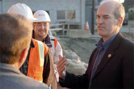 U.S. Rep. Rick Larsen talks to city officials and construction crew members working at the new waste water treatment facility in Arlington on Nov. 12.
