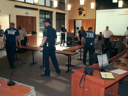 Arlington Fire Department personnel prepare an emergency operations center at City Hall during a mock earthquake exercise in June. City agencies have been working together on emergency preparedness plans and preparing for a possible Swine Flu pandemic in Arlington.