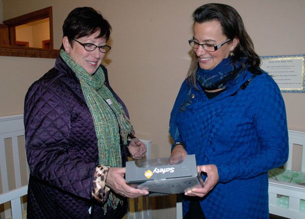 Arlington City Council member Deborah Nelson and Cocoon House CEO Cassie Franklin check out the features of the bedrooms for babies and mothers at Cocoon House’s maternity group home