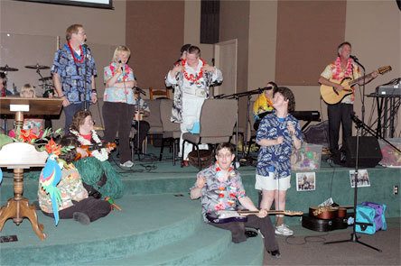 Members of Voices of the Village perform during the annual Taste of Decadence fundraiser in June. The band will perform on Sept. 12 during the second annual “Friendship Walk” in downtown Arlington.