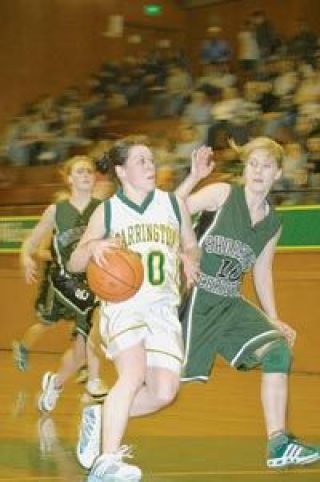 Senior Lady Logger guard Kristy Turner drives against a Shoreline Christian defender Tuesday