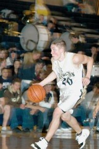 Arlington senior guard Kevin Gray keeps his eyes open for a teammate in Wesco North action Friday