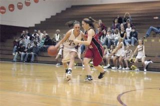 Aly Stewart runs the ball upcourt. The senior forward had nine points against Coupeville.