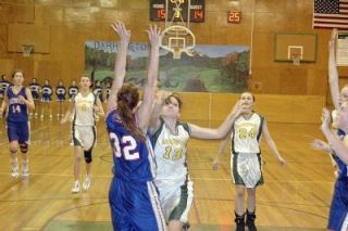 Haley Wales goes up in traffic against LaConner. The freshman finished with 13 rebounds and five steals but was limited due to foul trouble.