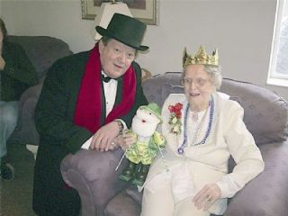 Father Jim Dalton arrives at Anna Lockharts 102nd birthday party to wish well the official matriarch of the Immaculate Conception Church in Arlington.