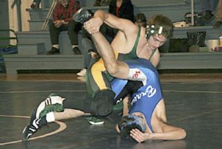 Darringtons Paden Newberry wraps up his La Conner opponent during another big team win for the Loggers 66-18.