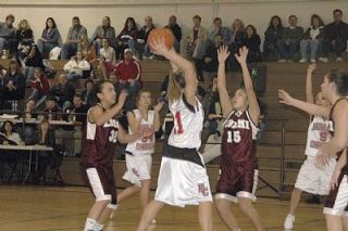 Chelsea Graber looks through traffic for a pass during the Lady Knights 62-38 loss to Lummi.