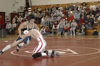 Matt Hale slips out of a takedown attempt during the Battle of the Bull Jan. 22. Arlington captured the Bull trophy on Stanwoods mat
