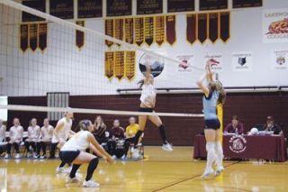 Aly Stewart whips another kill down on the Sultan Lady Turks. Stewart led the Cougars with 11 kills in their three-set victory.