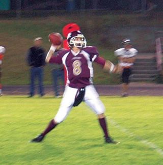 Freshman quarterback Justin Lane winds up and fires. Lane flashed signs of greatness in leading the Cougars over Granite Falls