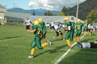 Mike Parris breaks free of the defense on one of his two touchdown runs during the Loggers Oct. 12 clash with Orcas Island.