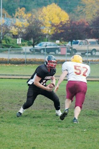 Vincent Kurtzenacker dodges a tackle during Highland Christian Preps 54-28 victory over Lopez.