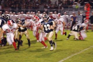Running back Michael Keating turns the corner on the Spartans.  Keating was finding room to ramble all night as the Eagles dominated the trenches.