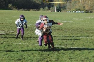 Brock Schubert rushes around the outside on his way to an 8-yard gain.