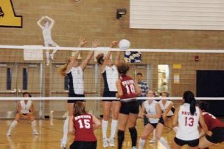 Kyra Prause and Kelsey Czban get up to block this kill attempt from Cascade.