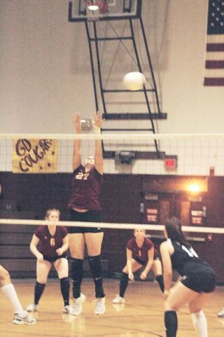 Tawnya Hulslander deflects a Coupeville spike attempt during Lakewoods convincing three set victory over the Wolves.