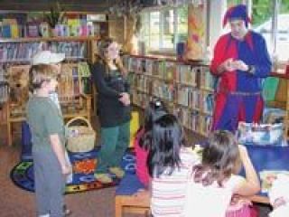 A balloon animal artist known as Owl Jester furnished children with their own inflatable pets at the Arlington Library Sept. 30.