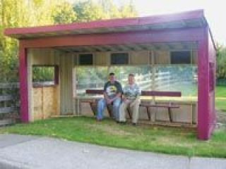 Jacob McAdams and Phillip Jantz sit back and relax on the bench they installed in the eight-foot-tall