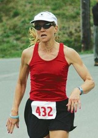 Carla Darr of Woodinville appears to give it her all in her final strides toward the finish line Saturday