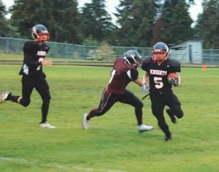 Caleb Georgia Brown rushes around the left side for a 7-yard gain.  Georgia scored a pivotal third quarter touchdown to put the Knights ahead 20-0.
