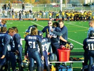 Coach Bill Schwartz hugs fullback Donovan Evans following the Eagles Super Bowl victory.