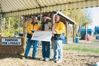 Pumpkins paid off big time last weekend as the Marysville Rotary handed out checks on Oct. 28 to three local school districts to help with reading programs.  The Pumpkins for Literacy patch moved to a new location at the Plant Farm at Smokey Point this October