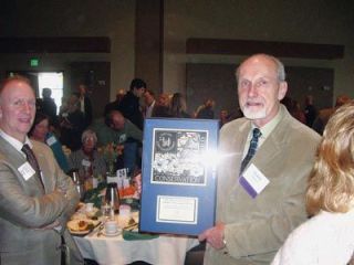 Duane Weston receives one of two Phil and Laura Zalesky Lifetime Achievement Awards presented at the Cascade Land Conservancy fundraising