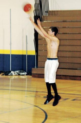 Craig Crawford lines up a long jumper during a pre-season practice scrimmage. Coach Jim Underwood expects Crawford to dial long distance for the time regularly this year.