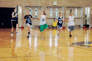 The Eagles girls basketball team warms up before a pre-season practice. Coach Nathan Davis has a young group with a lot of potential.