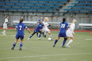 Midfielder Erin Dierickx gets to this ball ahead of the Whidbey pressure.