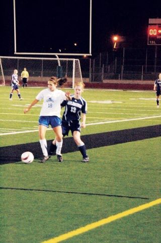 Kristina Longosky defends in the midfield for the Eagles. Arlingtons defense played strong all night