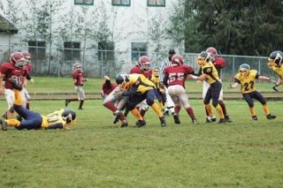 Tackle Zachary Kurtz wraps up a Bellingham ball carrier. Kurtz and the Eagle defense held the Regulators to a paltry eight points.