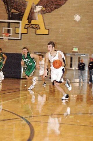 Guard Will Heath races ahead of the retreating Bulldog defense to score a lay up.