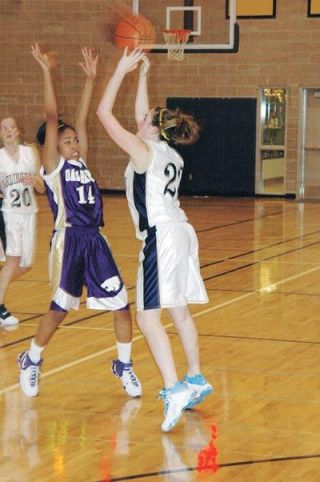Forward Alisha Murrin gets a jumpshot off from the left corner during Arlingtons 58-23 loss.