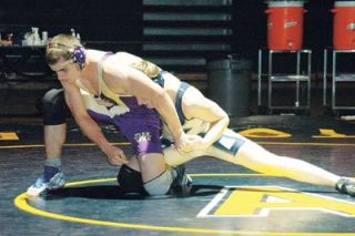 Jordan Anderson stretches out for a takedown. Anderson nearly pulled off an upset for the Eagles at 189 pounds