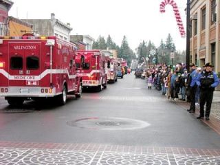 The Arlington Hometown Holidays Santa Parade packs the new Olympic Avenue.