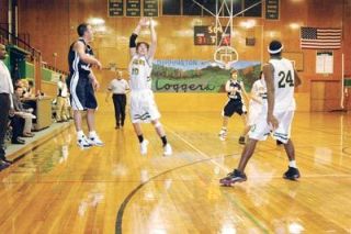 Justin ODell leaps to deflect a cross court pass for the Darrington defense. ODell led the way in the fourth quarter with two steals for the Loggers.