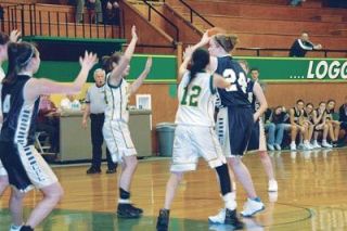 Kimi Woodward and Daneen Green harass the ball handler for Cedar Park.