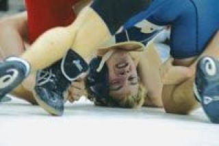 Junior 119-lb. wrestler Jeremy Goheen struggles with his Bellingham High School opponent Saturday