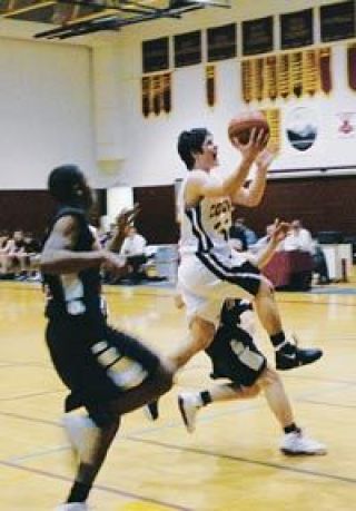 Lakewoods Dan Borisov splits two Archbishop Murphy defenders as he drives to the basket Feb. 9.