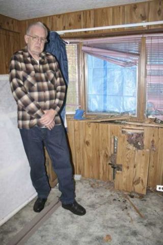 Randall Phillips expects the explosion damage to his bedroom wall and window will cost him $4