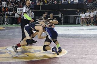 Arlingtons Chris Myers applies pressure to Ivan Gaeta of Olympic during their match on Feb. 15.