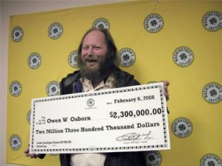 Owen Osborn proudly shows off his Lotto winnings Feb. 7.