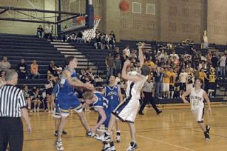 Forward Brad McPherson puts up a fadeaway jumper over the Golden Eagle defense in the third quarter of Arlingtons 65-61 loss to Ferndale on Feb. 19.