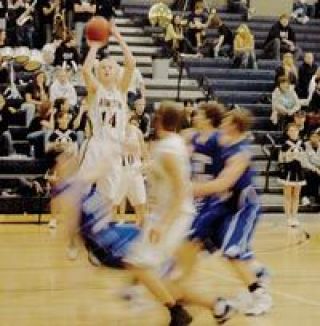 Arlington senior guard Andrew Disotell gets an open look in the fourth period of their Feb. 17 win over the Cubs of Sedro-Woolley.