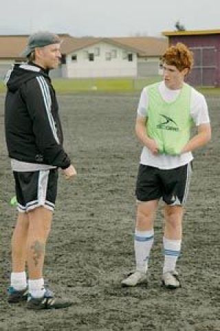 Coach Vandelac discusses tactics with midfielder Erik Hawks.