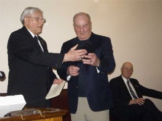 Ray McClure accepts the Howard Christianson Outstanding Citizen of the Year award from George Fischer