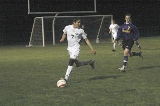 Sophomore midfielder Juan Guadarrama looks for an open teammate further upfield.
