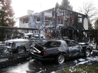 A two-story house was destroyed and four cars were damaged by a fire that started early Saturday morning south of the Arlington Airport.